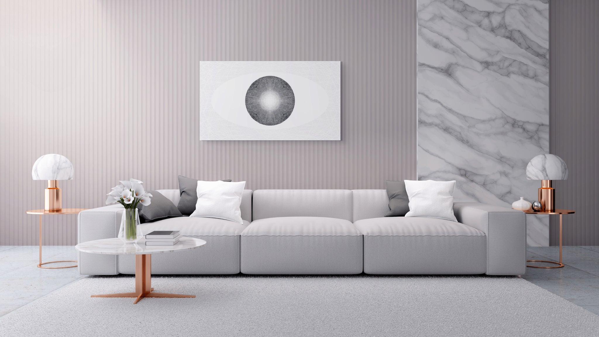 A modern living room scene featuring a light grey sofa with white and gray pillows, a round white coffee table with a copper-toned stand, two matching table lamps, and a large abstract circular wall art piece hanging above the sofa.