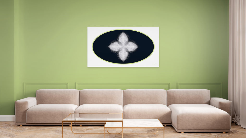 Beige sectional sofa in a living room with a green wall and geometric white, black and green artwork on wall.