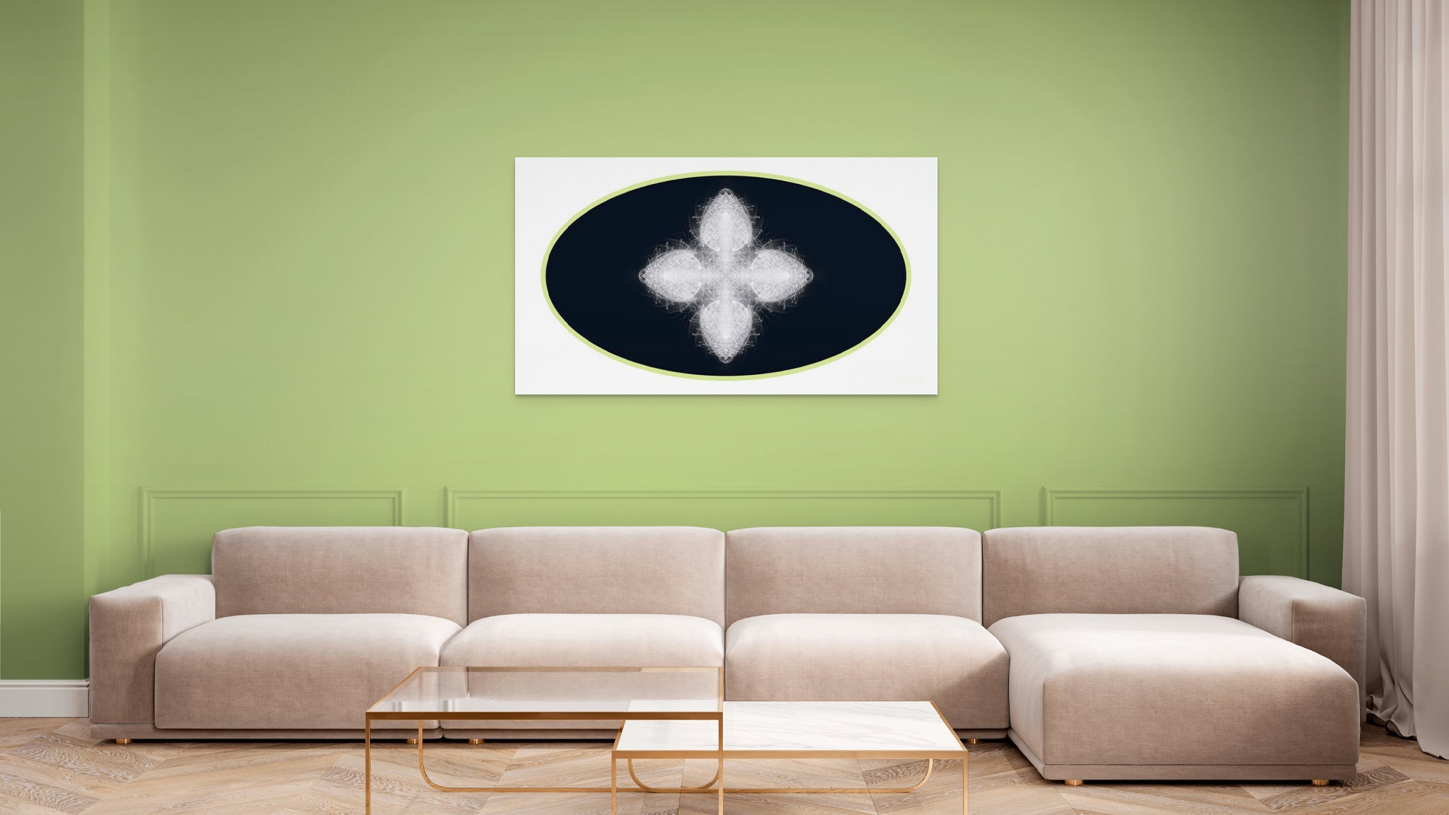 Beige sectional sofa in a living room with a green wall and geometric white, black and green artwork on wall.